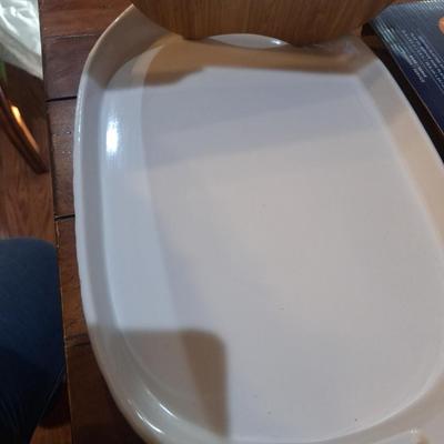 Corning Ware French White III Serving Platter with a wood cutting board