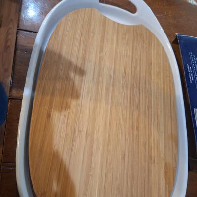 Corning Ware French White III Serving Platter with a wood cutting board