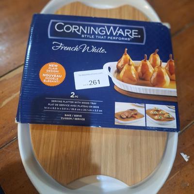 Corning Ware French White III Serving Platter with a wood cutting board
