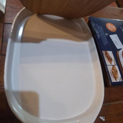 Corning Ware French White III Serving Platter with a wood cutting board