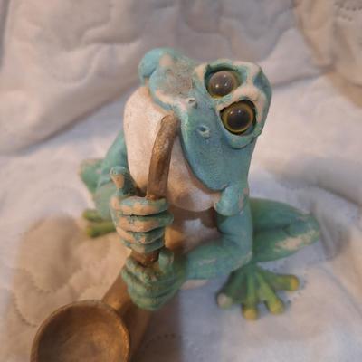 frog playing saxophone figurine