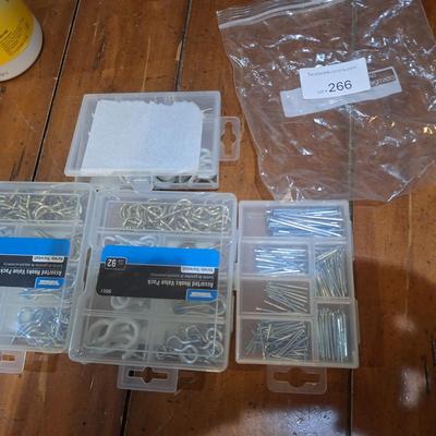 assortment of hardware, nails, screws, cup hooks etc.