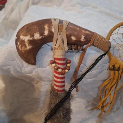 Native American-style decorative tomahawks or war clubs,