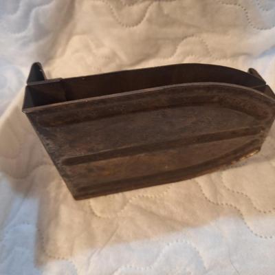 vintage or antique iron or sad iron holder.