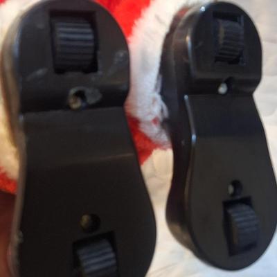 vintage animated Santa Claus doll with a rubber face and a bell. - has wheels on feet