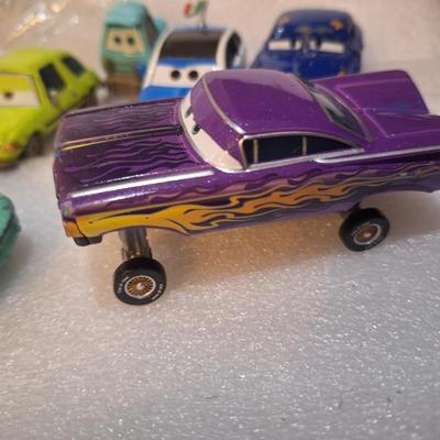 die-cast vehicles from the Disney/Pixar Cars franchise, Flo, Ramon and others.