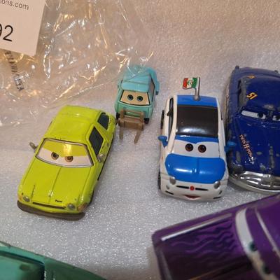 die-cast vehicles from the Disney/Pixar Cars franchise, Flo, Ramon and others.