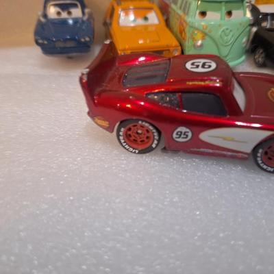 die-cast vehicles from the Disney/Pixar Cars franchise, includes lighting McQueen with Rusteze sponsor