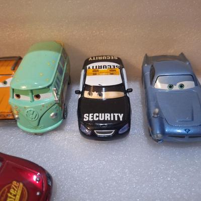 die-cast vehicles from the Disney/Pixar Cars franchise, includes lighting McQueen with Rusteze sponsor