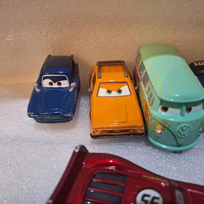 die-cast vehicles from the Disney/Pixar Cars franchise, includes lighting McQueen with Rusteze sponsor