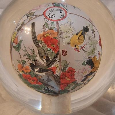 Chinese reverse hand-painted glass sphere, also known as an inside-painted glass ball or paperweight.