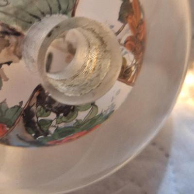 Chinese reverse hand-painted glass sphere, also known as an inside-painted glass ball or paperweight.