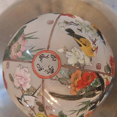 Chinese reverse hand-painted glass sphere, also known as an inside-painted glass ball or paperweight.