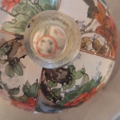 Chinese reverse hand-painted glass sphere, also known as an inside-painted glass ball or paperweight.