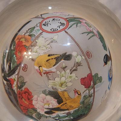 Chinese reverse hand-painted glass sphere, also known as an inside-painted glass ball or paperweight.