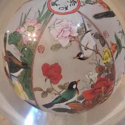 Chinese reverse hand-painted glass sphere, also known as an inside-painted glass ball or paperweight.