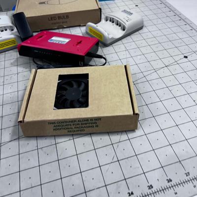 Odd Lot of Electronic Items: Bulbs, Switches, Charges