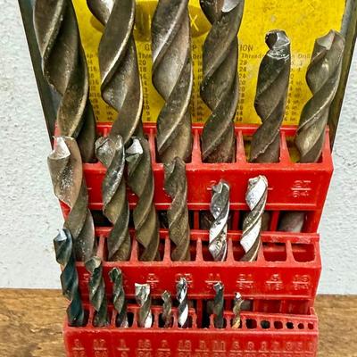 Sale Photo Thumbnail #565: All drill bits are used, some sizes are missing.  Box has slight corrosion on the outside, but is in solid condition.