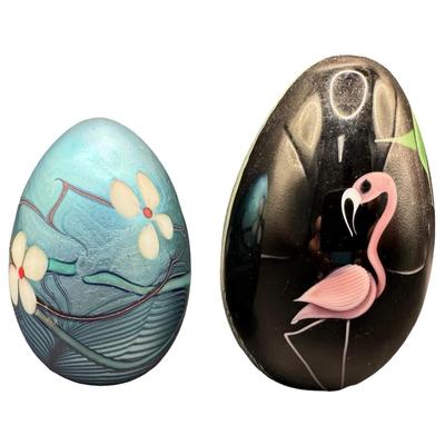 Sale Photo Thumbnail #2: Two pieces. One features a flamingo. The other is iridescent blue with white dogwood flowers. Measurement of largest: 4”H. Pre-auction estimate: $200-$400. [MA]