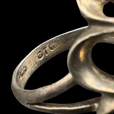 Sale Photo Thumbnail #38: This ring features an elongated oval black onyx. The ring size is 7.75. [GD]