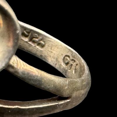 Sale Photo Thumbnail #37: This ring features an elongated oval black onyx. The ring size is 7.75. [GD]