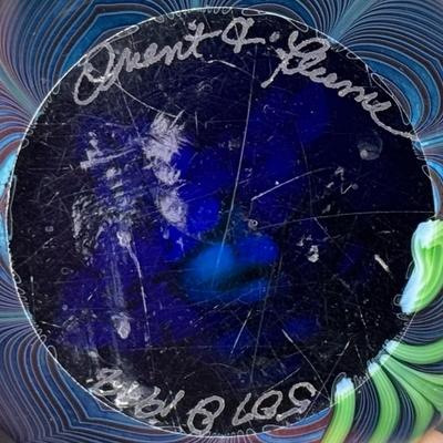 Sale Photo Thumbnail #59: Three pieces. One depicts a butterfly; one is iridescent with flower and feathers; and one is iridescent with pulled feathers. Measurement of largest: 3.5” Diameter. Pre-auction estimate: $300-$500. [MA]