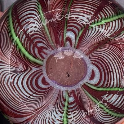 Sale Photo Thumbnail #60: Three pieces. One depicts a butterfly; one is iridescent with flower and feathers; and one is iridescent with pulled feathers. Measurement of largest: 3.5” Diameter. Pre-auction estimate: $300-$500. [MA]