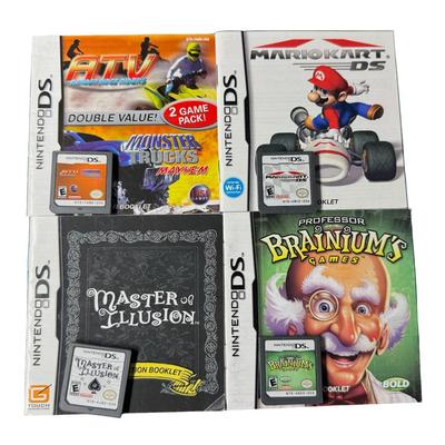 Sale Photo Thumbnail #64: Includes DS Lite, four games, A/C charger, and instruction manuals. Not tested. Pre-auction estimate: $50-$70. [KD]