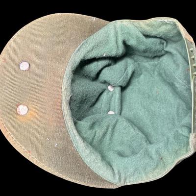 Sale Photo Thumbnail #69: This cap has the original “AutoLite” carbide lamp. The cap and lamp have age related wear. There is no glass lens on the lamp. Not tested. [KD]