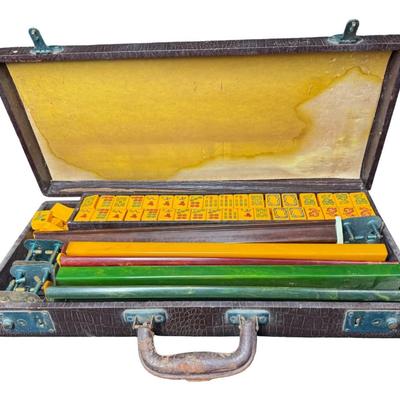 Sale Photo Thumbnail #72: Made for the U.S. market. Most likely from the 1920s. Includes 122 butterscotch Bakelite tiles, five racks, and original case. May or may not include all of the original accessories. [KD]