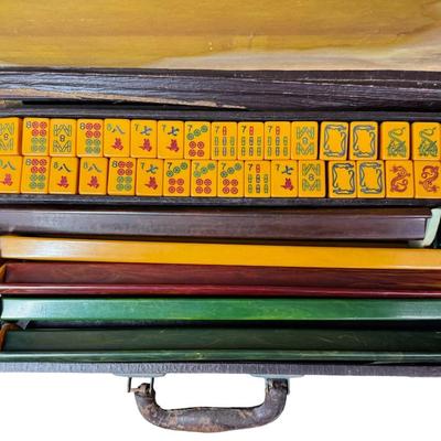 Sale Photo Thumbnail #73: Made for the U.S. market. Most likely from the 1920s. Includes 122 butterscotch Bakelite tiles, five racks, and original case. May or may not include all of the original accessories. [KD]