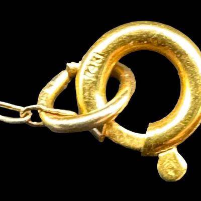 Sale Photo Thumbnail #91: [2.90g] This necklace features a religious pendant on a delicate cable chain. Length of chain: 20”L. Gold content confirmed using Niton XRF precious metals analyzer. [GD]