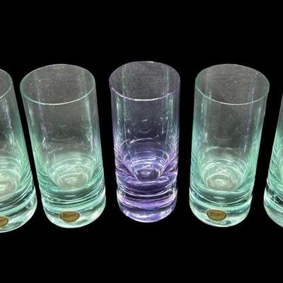 Sale Photo Thumbnail #104: Made in Czechoslovakia. Includes six ocean blue colored glasses, and one amethyst colored glass. Total of seven glasses. No obvious chips or cracks. Measurement: 5”H (each). Pre-auction estimate: $200-$300. [RE]