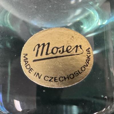 Sale Photo Thumbnail #106: Made in Czechoslovakia. Includes six ocean blue colored glasses, and one amethyst colored glass. Total of seven glasses. No obvious chips or cracks. Measurement: 5”H (each). Pre-auction estimate: $200-$300. [RE]