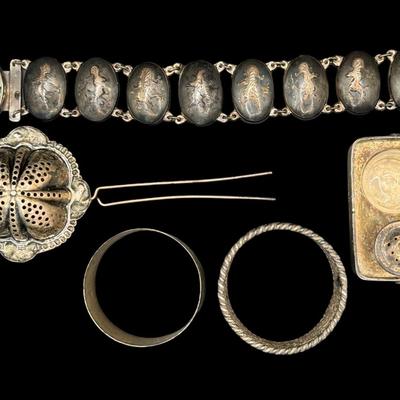 Sale Photo Thumbnail #112: [136g] Includes napkin rings, a Siam bracelet, a tea basket, and a Japanese Meiji salt service. Total of five pieces. Silver content confirmed using Niton XRF precious metals analyzer. [KD]