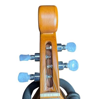 Sale Photo Thumbnail #138: This is signed by George Looney, and features walnut construction with faux mother of pearl tuners. There is a paper label on the inside. Gently used. Includes original case. Pre-auction estimate: $200-$300. [SR]