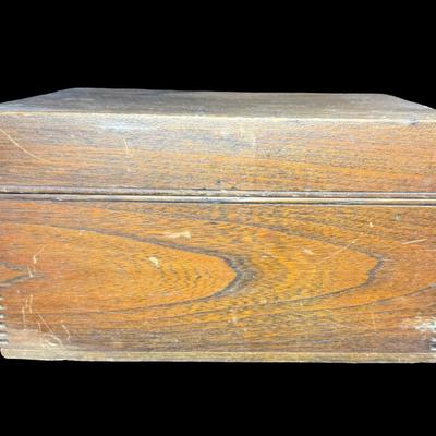 Sale Photo Thumbnail #159: Made in U.S.A. This has dovetailed wood construction, a glass lining, and a brass humidor unit on the underside of the lid. There is some age related wear. Not tested. Measurement: 11.5”L x 8”W x 6.5”H. [KD]