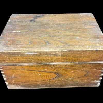 Sale Photo Thumbnail #160: Made in U.S.A. This has dovetailed wood construction, a glass lining, and a brass humidor unit on the underside of the lid. There is some age related wear. Not tested. Measurement: 11.5”L x 8”W x 6.5”H. [KD]