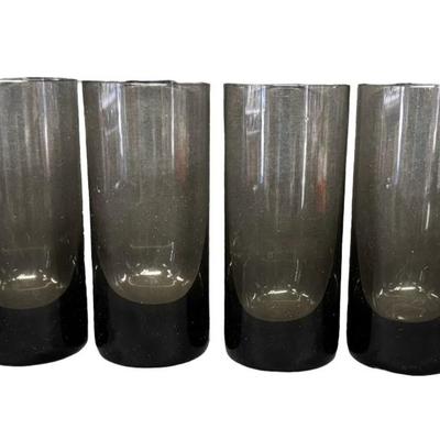 Sale Photo Thumbnail #176: Total of six smoky colored glasses. Made in Czechoslovakia. No obvious chips or cracks. Measurement: 6”H (each). Pre-auction estimate: $200-$300. [RE]