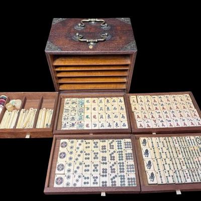 Sale Photo Thumbnail #197: Includes 144 ivory and bamboo tiles, counting tiles, and dice, in a five-drawer dovetailed wood box. Measurement: 9.5”L x 7”W x 7.5”H (box). Pre-auction estimate: $250-$350. **Winning bidder must present valid Florida ID at local auction pickup.** [