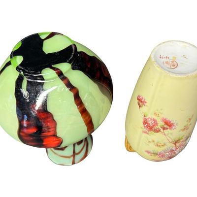 Sale Photo Thumbnail #203: Includes a double handled porcelain vase (7.5”H), and a uranium glass vase (7.5”H). Total of two pieces. [MA]