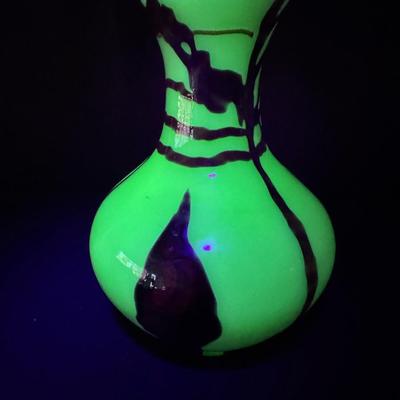 Sale Photo Thumbnail #202: Includes a double handled porcelain vase (7.5”H), and a uranium glass vase (7.5”H). Total of two pieces. [MA]