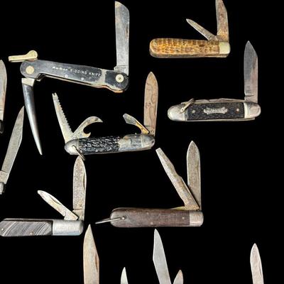 Sale Photo Thumbnail #250: Includes Kabar, Camper, Barlow, Puma, and more. Total of 22 pieces. Some pieces have age related wear, including stained/rusted blades, and possibly some chipped or cracked handles. [KD]