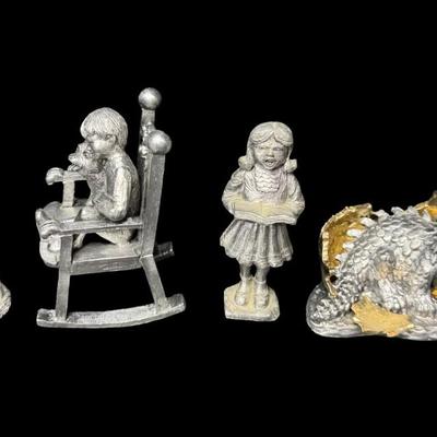 Sale Photo Thumbnail #275: NOS. Includes Danny, Dinah, Ray, Kathy, Sandy, and more. Total of seven pieces. The little girl with a book has a cracked leg. There is storage related wear with some patina. Measurement of tallest: 4.25”H. [SR]