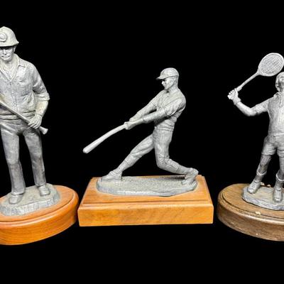 Sale Photo Thumbnail #297: NOS. Includes Mitch the baseball player, Wayne the tennis player, and The American’s “Jason.” Total of three pieces. There is storage related wear with some patina. Measurement of tallest: 10”H. [SR]