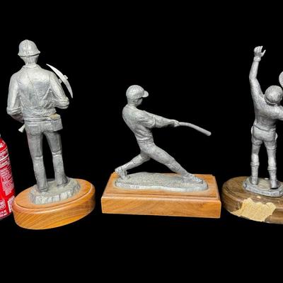 Sale Photo Thumbnail #298: NOS. Includes Mitch the baseball player, Wayne the tennis player, and The American’s “Jason.” Total of three pieces. There is storage related wear with some patina. Measurement of tallest: 10”H. [SR]