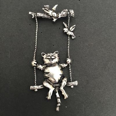 Sale Photo Thumbnail #164: Very cute Silver Tone cat swinging brooch 
Please see attached photos