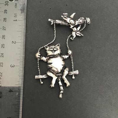 Sale Photo Thumbnail #166: Very cute Silver Tone cat swinging brooch 
Please see attached photos