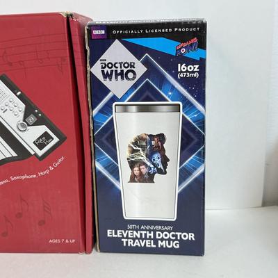 LOT 82: NIP Novelty & More: Light Bar+, Golden Girls Coasters, Roll-up Piano & More