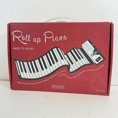 LOT 82: NIP Novelty & More: Light Bar+, Golden Girls Coasters, Roll-up Piano & More